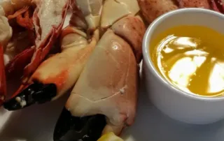 A plate of stone crab claws and half lobster tails