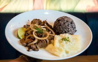 Grilled steak, Congri and Yuca with onions.