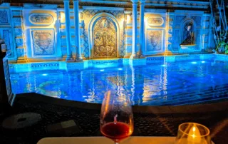 A glass of wine in front of the pool at Gianni's