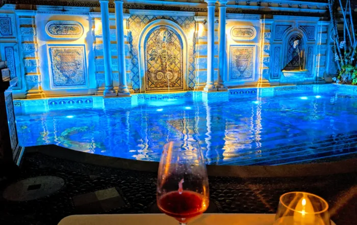 A glass of wine in front of the pool at Gianni's