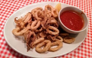 Fried Calamari with a cup of marinara sauce