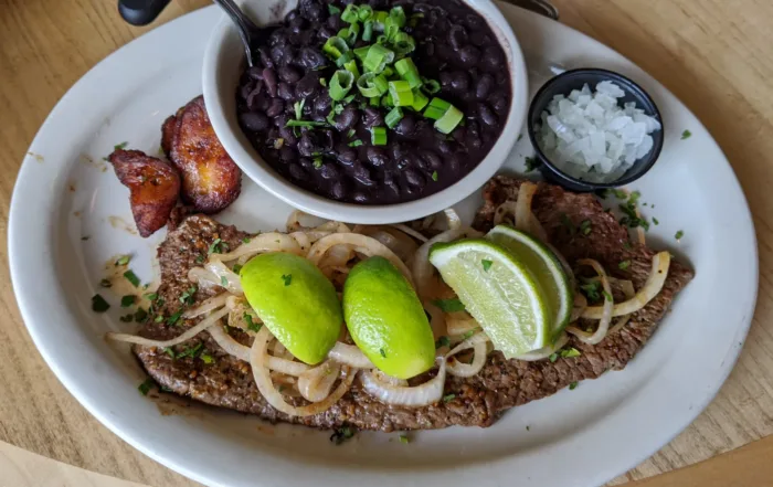 Grilled Steak with a cup of Black Beans