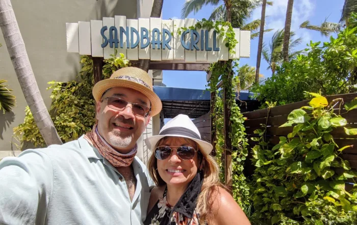Dan and Doris in front of the Sandbar sign
