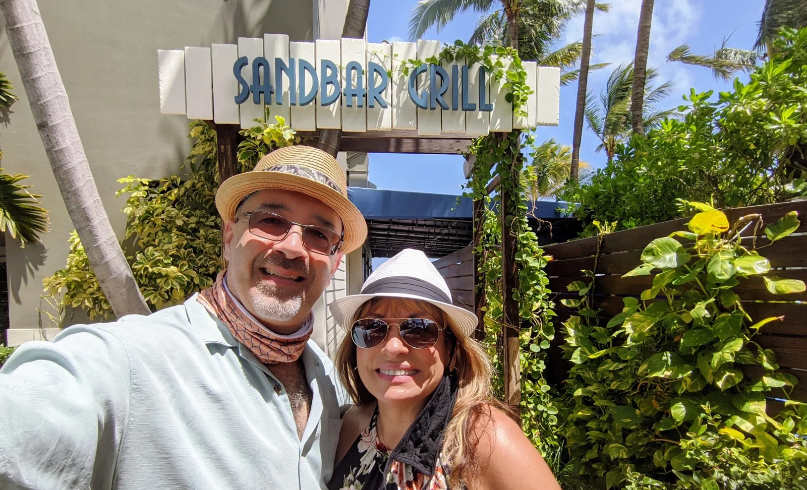 Dan and Doris in front of the Sandbar sign
