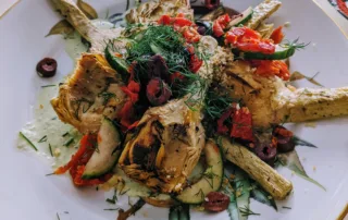 Artichoke Salad topped with a sprig of dill