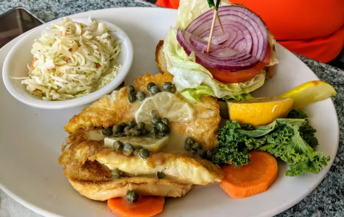Fried Lion Fish Sandwich with lemon and capers
