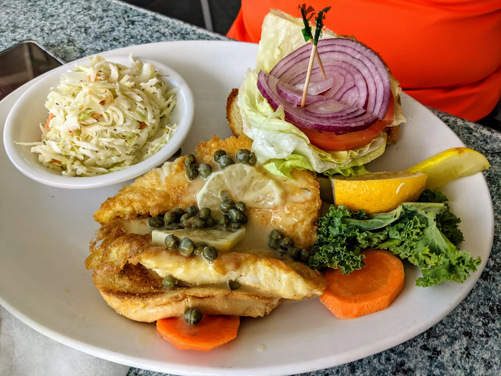 Fried Lion Fish Sandwich with lemon and capers
