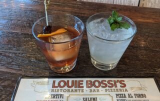 Two Drinks and the top of the Louie Bossi Menu
