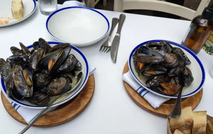 2 bowls of Mussels in a white wine sauce