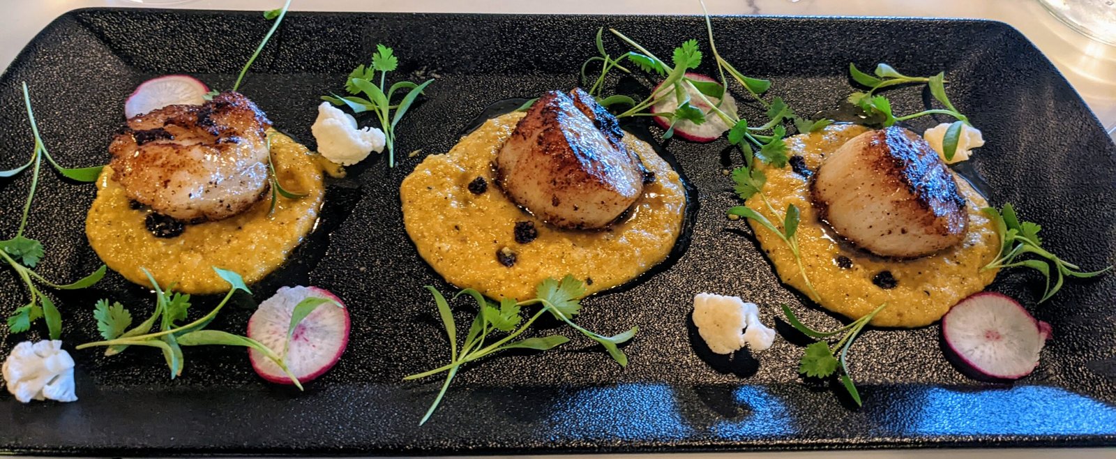 3 pan seard scallops set on puree potato