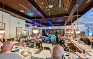 Lounge area with alot of seats and a stage