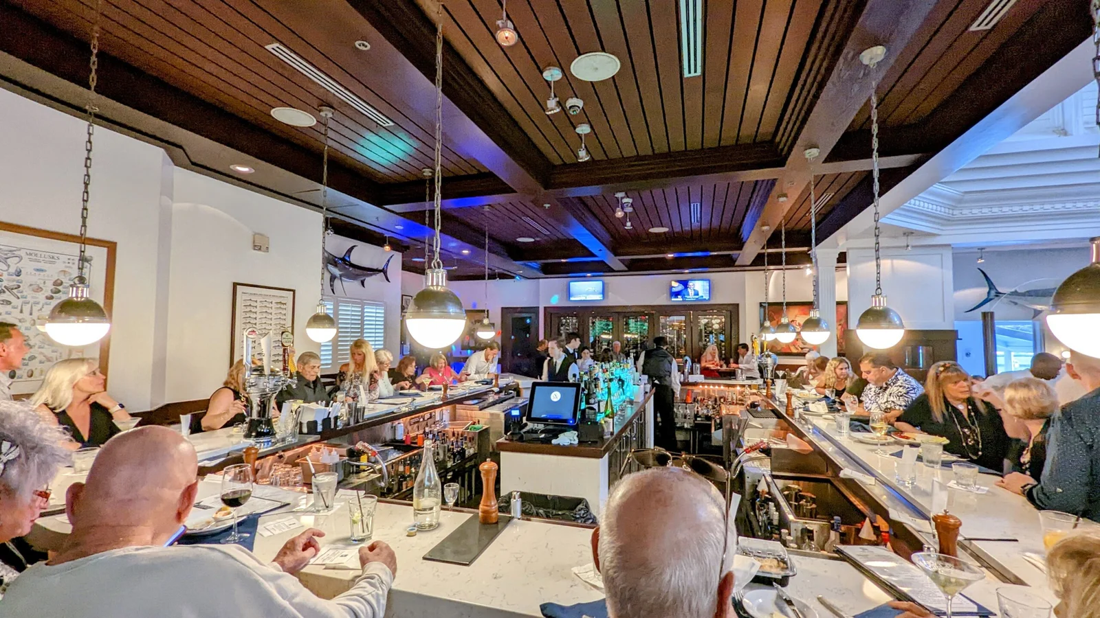 Lounge area with alot of seats and a stage