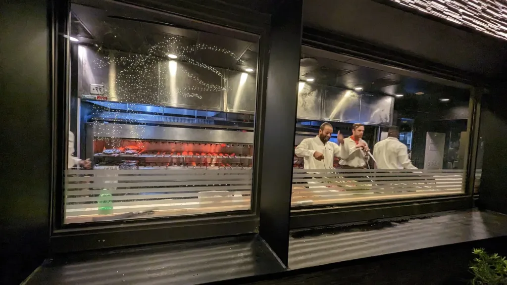 Chefs at Chima cooking meats in oven