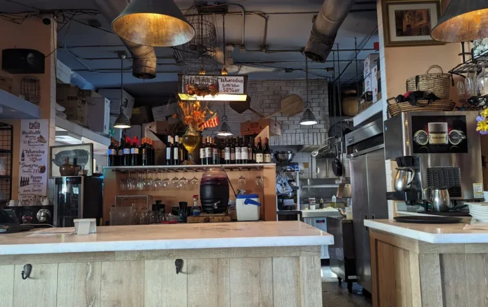 A picher of Sangria behing the small indoor bar are