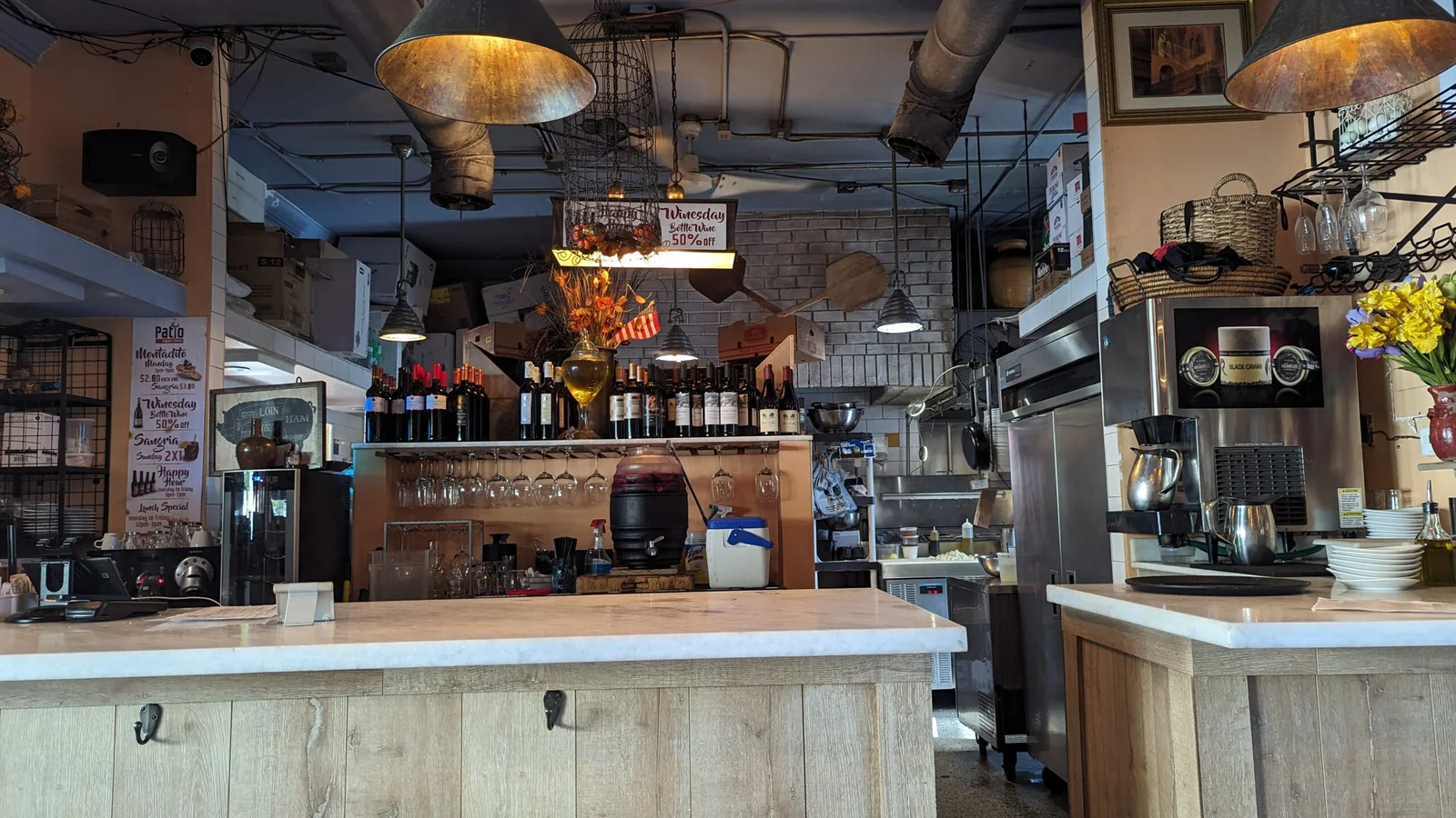 A picher of Sangria behing the small indoor bar are