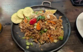 Fried rice with cucumber sliced garnish