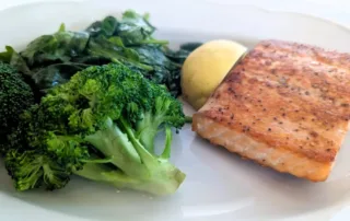 Grilled Faroe Islands Salmon, spinach, and steamed Broccoli