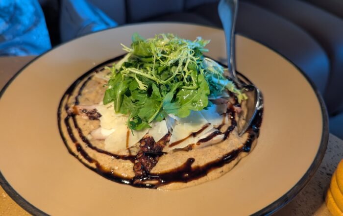 Grilled Mediterranean octopus over creamy truffle–scented orzo, pecorino and finished with balsamic reduction.