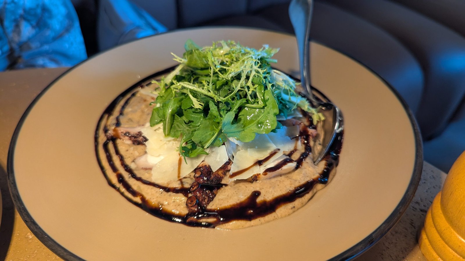 Grilled Mediterranean octopus over creamy truffle–scented orzo, pecorino and finished with balsamic reduction.