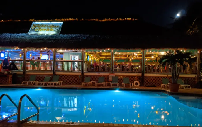 The lit pool at night at Sunset Grille