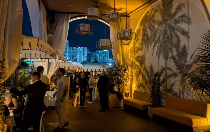 Outdoor dining area with Miami lights view
