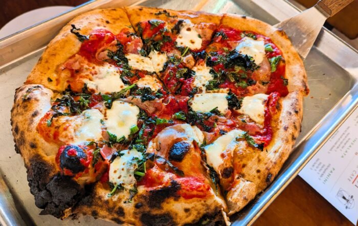 Valle d’Aosta: Pizza topped with savory pancetta and perfectly balanced chopped broccoli rabe, it was layered with mozzarella and garlic