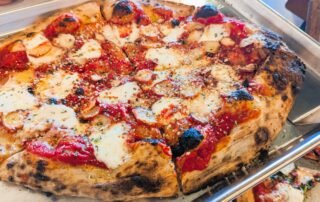 Sardegna: Pizza topped with thinly sliced, perfectly grilled octopus, fresh mozzarella, garlic, and parsley. Finished with Pecorino Romano and a drizzle of EVOO