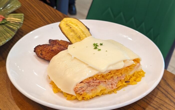 Rice stirred with Chicken and topped with Melted Cheese