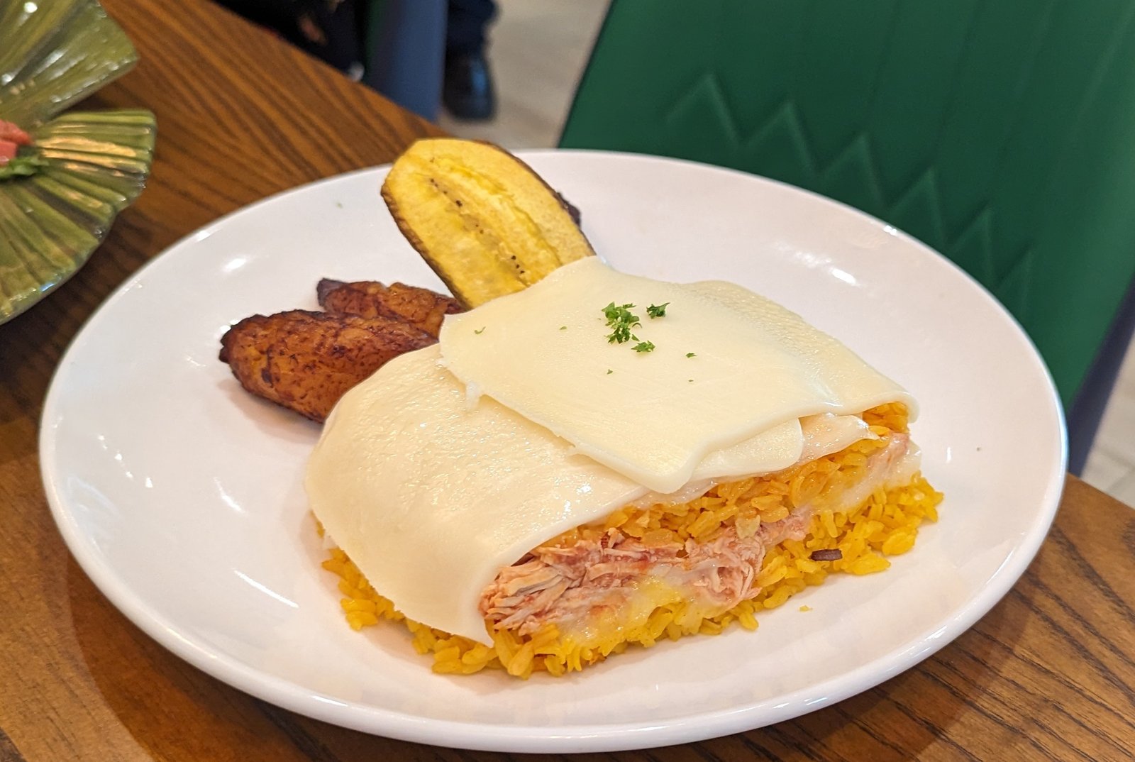 Rice stirred with Chicken and topped with Melted Cheese