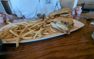 grilled chicken and caramelized onions topped with melted mozzarella, all tucked between hot-pressed Cuban bread.