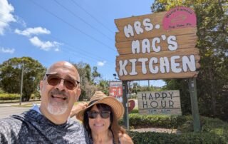 Doris and Dan in front of the sign