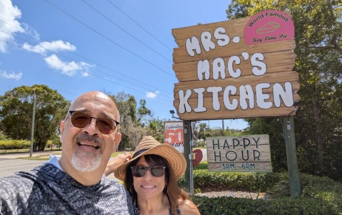 Doris and Dan in front of the sign