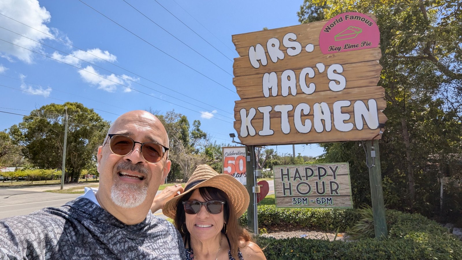 Doris and Dan in front of the sign