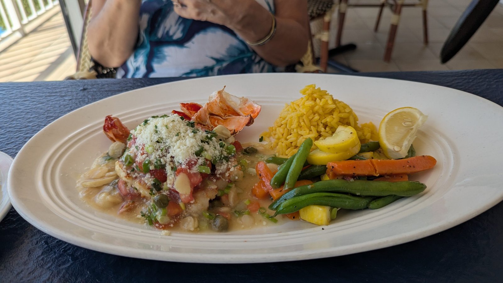 Lobster in a white sauce with rice and veg