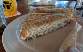Frueben Crispy dolphin, swiss, and coleslaw on rye